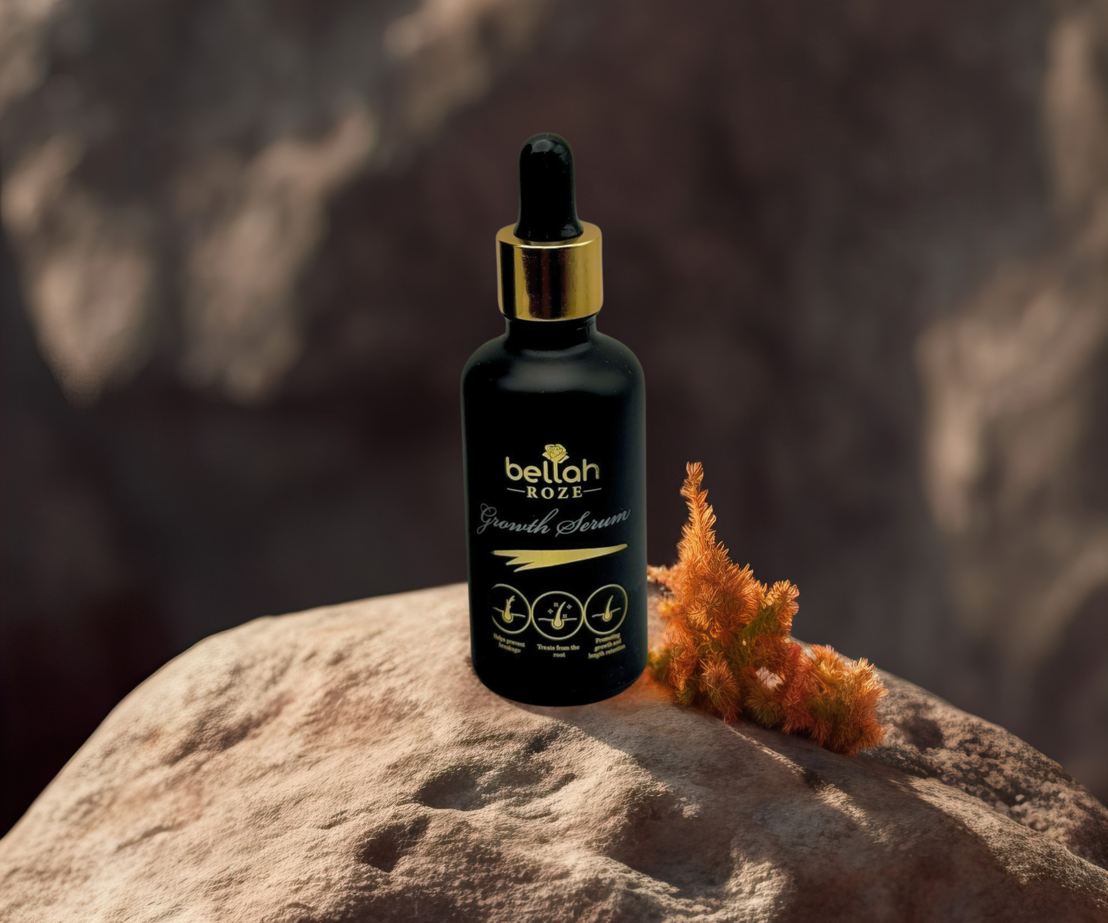 Hair growth oil in luxury black and gold packaging
