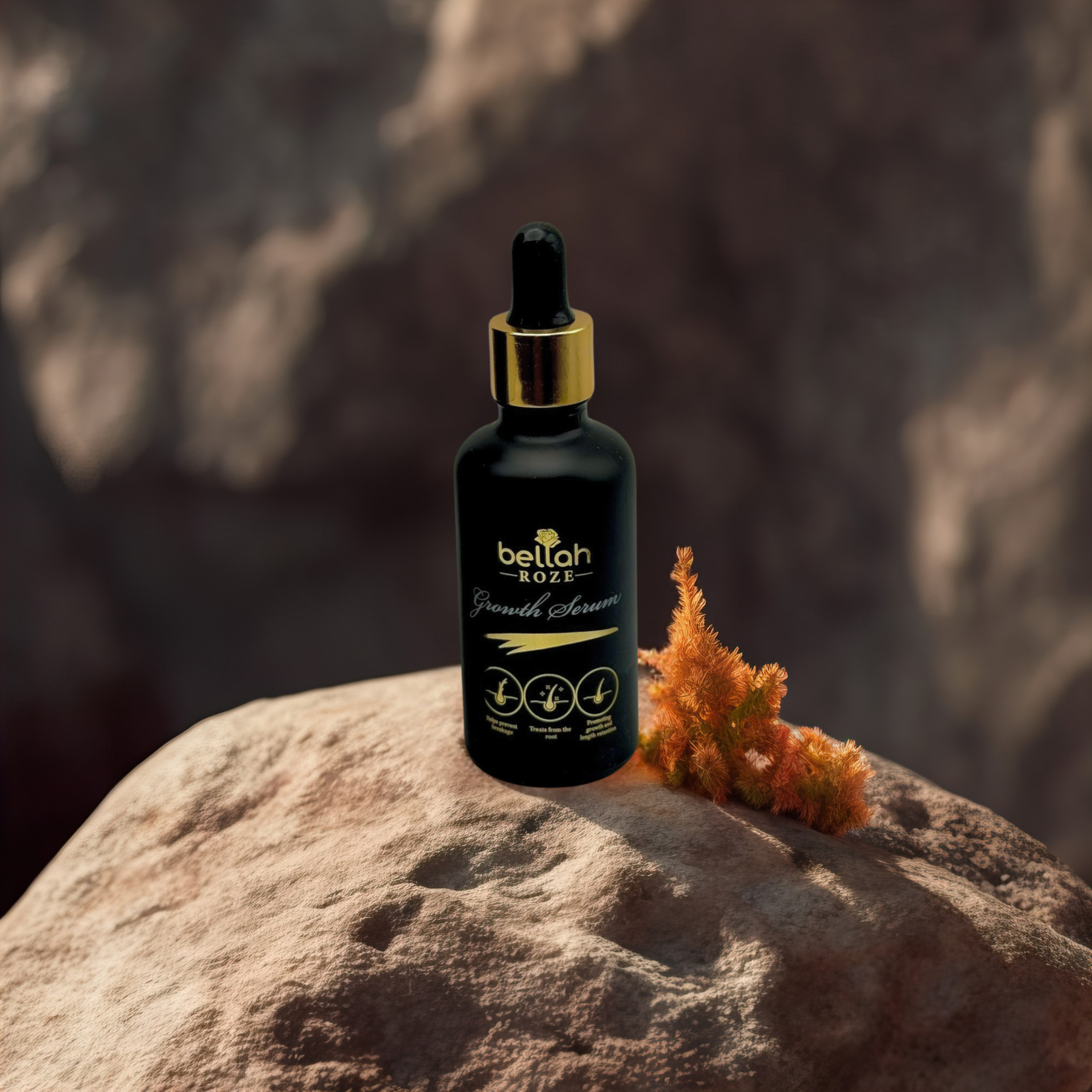 Hair growth oil in luxury black and gold packaging