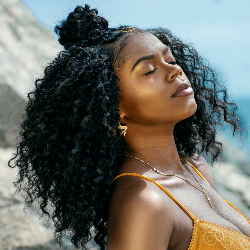 beautiful african american woman with long natural luxurious curly hair 